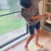 Family using surf balance board at home, practicing balance exercises